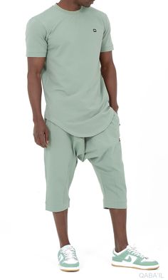 QL Relaxed Fit Nautik Set in Almond Green Description:Enjoy the warmth of summer with a fresh new look! This T-shirt and shorts set offers comfort, functionality and style. Featuring a shirt with a round neck and a stylish round hem and a three-quarter shorts that lets you enjoy the sun while keeping covered. This holiday wardrobe is all you need to feel at your best this season. Modern Islamic clothing for men Very high-quality fabric from top brands Short sleeved T-shirt with a small logo on the left chest Shorts with two zipped side pockets and elastic waist Modest Fashion Compliant (Halal Compliant) Details: Materials: 50% cotton; 40% polyester; 10% elastane Style: Casual, Sportswear and Events Care Tips: Wash at 30° Casual Summer T-shirt For Leisure, Relaxed Summer Loungewear T-shirt, Relaxed Summer T-shirt For Loungewear, Summer Athleisure Tops For Leisure, Green Summer Streetwear Tops, Summer Crew Neck Top For Loungewear, Summer Loungewear Top With Crew Neck, Cotton Short Sleeve Tops For Leisure, Fitted Tops For Leisure In Spring