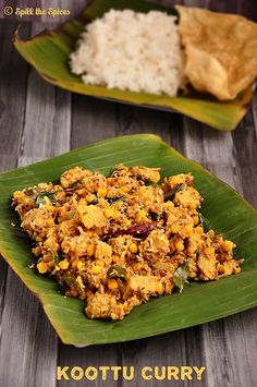 some food is sitting on a green leaf next to rice and other foods are in the background