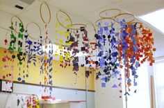 colorful paper streamers hanging from the ceiling in a classroom