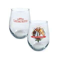 two wine glasses with christmas images on them