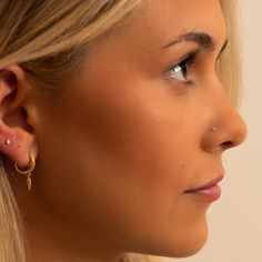 Adorn your nose in timeless style with this gift set of three diamond nose rings. Featuring a 14K white gold baguette, round, and perlage diamond design, its delicate beauty adds a sophisticated touch to your piercing. Crafted with exceptional quality, this trio is the perfect addition to your piercing collection. 20G Genuine VS1 Diamonds, G-H color Each diamond measures 1.5mm (.015ct) Solid 14k gold | Nickel-free | Hypoallergenic Ethically handmade in the USA Dainty Nose Piercing, Small Nose Studs, Piercing Collection, Diamond Nose Ring, Nose Piercing Stud, Small Nose, Cool Ear Piercings, Vs1 Diamond, Nose Shapes