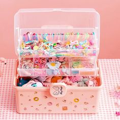 a pink box filled with lots of different items