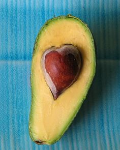 an avocado with a heart cut in half