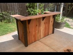 an outdoor bar made out of wooden boards