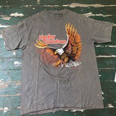 Vintage 1980s Harley Davidson-For Bikers only eagle tee  Some bleaching marks  Otherwise never worn condition  No tags  Reads L  All cotton  Measurements taken laying flat  Pit to pit 20  Length 27.5 Eagle Tee, Toledo, Fancy Dresses, Harley Davidson, Mens Accessories, Adult Outfits, Tops & Tees