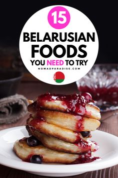 a stack of pancakes with berries on top and the words 15 belarsian foods you need to try