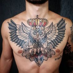 a man with an owl and crown tattoo on his chest