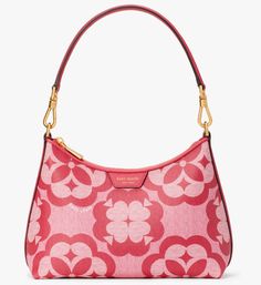 Kate Spade Reece Small Shoulder Bag Pink Monogram Flower PVC / Color Code: raspberry jam multi (650) New with Tags; Authenticity Guaranteed! K9773 / Retail $278 You’ve seen our Spade Flower Jacquard collection. This season, we partnered back up with Limonta—a centuries-old family-owned textile mill in northern Italy that’s been producing and experimenting with jacquards for over 100 years—to create our newest addition: monogram coated canvas. A bold update to our signature pattern, the new Spade Flower Monogram coated canvas pays homage to old world elegance. It’s durable, easy to wipe clean and will hold up no matter what beautiful chaos the day brings. Here, we’ve used our seasonal coated canvas with oversized Spade Flower Monogram motifs on our Reece convertible shoulder bag—a versatile Luxury Floral Print Top Handle Bag, Luxury Pink Bags With Floral Print, Designer Bags With Floral Print For Spring, Elegant Red Bags With Floral Print, Designer Floral Print Bags For Spring, Luxury Pink Floral Print Bags, Elegant Red Floral Print Bags, Textile Mill, Flower Monogram