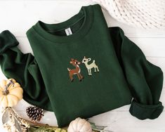 Rudolph & Clarice ❤️ Vintage Christmas sweater with embroidered design - available now! #rudolphtherednosedreindeer #embroidery #christmassweater #christmasoutfit Rudolph And Clarice, Embroidered Christmas Sweater, Vintage Christmas Sweaters, Rudolph Christmas, Winter Apparel, Cute Shirt Designs, Trendy Winter, Embroidery Sweatshirt