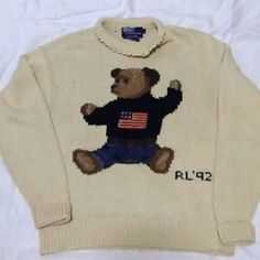 The Original Sit Down Bear From 1992 Not A Retro The Collar Is Turtleneck But Is Damaged If You Know A Good Tailor You Can Turn This Into A Crewneck The Year 1992 Was Huge For Ralph Laurens Polo Line Must Have For Any Collector ***All Used Items Are From My Personal Collection All My Items Are Kept In Storage Containers Please Keep In Mind When Purchasing. The Items May Or May Not Have That Fresh Scent. I Do Not Dry Clean Any Item Before I Ship Unless Requested. All Items Are In Great To Mint Condition Unless Stated, Nothing Has Holes, Rips, Or Stains. If Any Item Has Any Defects, I Will Make Note Of It Make An Offer***** Open To Offers Polo Bear Sweater, Sweaters Ralph Lauren, Ralph Lauren Bear, American Flag Sweater, Bear Sweater, Polo Ralph Lauren Sweater, Bear Hoodie, Polo Bear, Usa Outfit