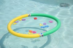 an inflatable pool toy with letters and numbers on the water's surface