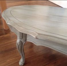 a white table sitting on top of a hard wood floor