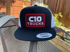 C10 Trucks Snapback Hat Patch Features On trend and adjustable, this snapback cap features a contrast underbill and seven snaps for sizing.| Fabric: 80/20 acrylic/wool, 98/2 cotton/spandex (multicam ® Styles) Features: green underbill, (multicam ® Styles) Structure: structured Profile: high Closure: 7-position adjustable snap (FAST SHIPPING) Fitted Trucker Snapback Hat With Flat Bill, Fitted Trucker Snapback Baseball Cap, Fitted Trucker Baseball Cap With Flat Brim, Fitted Snapback Trucker Hat, Fitted Trucker Snapback Hat With Curved Bill, Fitted Trucker Hat With Flat Brim, Fitted Black Trucker Snapback Hat, Black Fitted Trucker Snapback Hat, Hat Patch