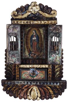 an ornate clock with the image of mary on it