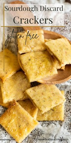 homemade sourdough discard crackers on a wooden plate with text overlay