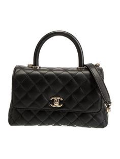 Chanel Top Handle BagFrom the 2021 Collection by Virginie ViardBlack LeatherInterlocking CC Logo & Quilted PatternGold-Tone HardwareRolled Handle & Chain-Link Shoulder StrapSingle Exterior PocketLeather Lining & Dual Interior PocketsTurn-Lock Closure at FrontProtective Feet at BaseIncludes Box & Dust BagUnfortunately, due to restrictions, this item may not be eligible for shipping in all areas. Chanel Top Handle, Chanel Top, Coco Handle, Chanel Mini, Handbag Handles, Cc Logo, Handle Bag, Chain Link, Top Handle