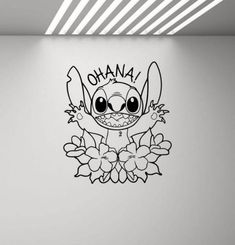 a wall with the word ohana on it and an image of a cartoon character