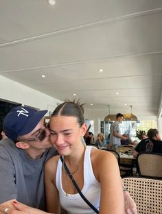 a man and woman are sitting at a table