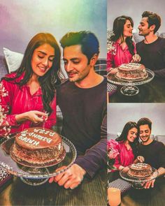 a man and woman sitting next to each other holding a cake