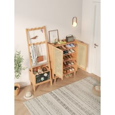 a room with a rug, shelf and mirror on the floor next to a door