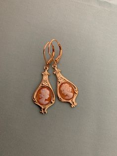 "Tiny real CAMEO Earrings, Hand Carved real CAMEOS Italy, Gold VERMEIL 925 sterling lever backs early 20th reproduction Edwardian earrings - HOLLOW BACK This listing is for a pair of reproduction early 20th century EDWARDIAN design earrings, created with gorgeous vintage HAND CARVED cameos from Italy, with a historic and classical design, finished with Gold VERMEIL (gold plated over 925 Sterling Silver) Lever backs. I simply adore this classic design: perfect for Edwardian, Titanic and Downton A Classic Rose Gold Earrings For Formal Occasions, Victorian Cameo Earrings For Formal Occasions, Classic Rose Gold Dangle Earrings, Classic Cameo Earrings, Classic Cameo Earrings Gift, Cameo Drop Earrings For Formal Occasions, Elegant Cameo Earrings As Gift, Heirloom Pierced Jewelry For Formal Occasions, Heirloom Earrings For Formal Occasions