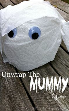 a toilet paper roll with googly eyes on it and the words unwrap the mommy