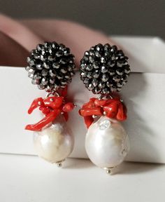 Black wedding earrings made of: - Baroque pearls, (16 mm), white color; - Red Coral branches; - Brass Earrings with assembled Crystals, silver color. Lenght : 5 cm / 1,97 inches * SHIPPING * Your order will be shipped within 1-3 business days from your purchase. You can choose between 2 shipping methods: STANDARD MAIL (NOT TRACEABLE) It is a cheap and fast shipping method, but NOT TRACEABLE. Chapeau Atelier is not responsible for any postal disruptions, delays or losses. REGISTERED MAIL (TRACEAB Elegant Red Pearl Earrings For Parties, Handmade Red Pearl Wedding Earrings, Handmade Red Pearl Earrings For Wedding, Red Pearl Drop Earrings For Formal Occasions, Red Pearl Drop Earrings For Party, Red Pearl Drop Bridal Earrings Gift, Elegant Red Bridal Earrings With Pearl Drop, Brass Earrings, Black Wedding