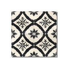 a black and white tile pattern with an intricate design on the back side of it