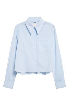 A boxy cotton button-up steps out of the office with a covered button placket and a cute cropped length. 21 1/2" length (size Medium) Front button closure Spread collar Long sleeves with button cuffs Chest patch pocket 100% cotton Dry clean Made in the USA Blue Collared Cropped Shirt For Work, Button-up Cotton Cropped Shirt, Trendy Blue Button-up Cropped Shirt, Cotton Cropped Shirt With Button Cuffs, Cotton Cropped Shirt With Button Cuffs For Spring, Trendy Cropped Shirt With Buttons For Work, Cotton Button-up Cropped Shirt, Cotton Button-up Cropped Shirt For Daywear, Cotton Cropped Button-up Shirt For Daywear