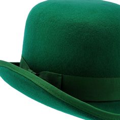 My Lucky Hat by Walrus Hats is a delightfully festive hat with a distinctly Irish flair! This daring derby hat is made from wool and comes in an exquisite shade of shamrock green with a matching grosgrain hatband. The brim is curled, as is traditional for the derby hat style, and is approximately 2" wide. The lofty 5" crown is rounded at the edges to create a unique leprechaun hat aesthetic! The interior has a super-soft satin lining and a leather sweatband for maximum comfort. Those with the Ir Green Hat Bands For Kentucky Derby, Winter Derby Felt Hat With Curved Brim, Curved Brim Felt Hat For Derby And Winter, Winter Derby Hats With Curved Brim, Curved Brim Hats For Winter Derby, Curved Brim Derby Hat For Winter, Green Fedora For Kentucky Derby, Wide Brim Hats For Winter Derby, Wide Brim Winter Derby Hats