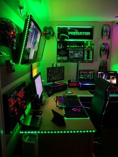 a gaming room with neon lights and monitors