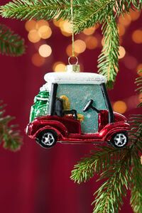 a golf cart ornament hanging from a christmas tree