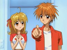 two anime characters standing next to each other with one pointing at the camera while the other looks on