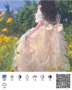 a girl in a dress is standing in a field with yellow flowers and looking at the camera