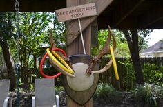 a deer antler ring tosser hanging from a wooden post