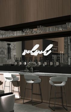 a bar with stools and bottles on the shelves in front of it that says portland