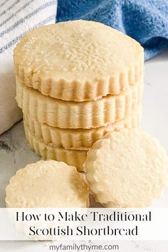 three cookies are stacked on top of each other next to a towel and blue towel