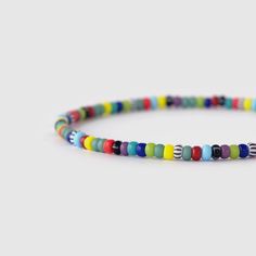 This multicolor bracelet features quality seed beads that strung by hand together on an elastic strand that easily slips on your wrist. Wear it alone or layer with a bunch of bracelets for the perfect look. D E T A I L S * 3mm glass beads. * Easy slip-on elastic design for comfortable everyday wear. * Available in various sizes for a customized fit. * Designed in Barcelona. All our pieces are crafted by hand and one-of-a-kind, and may therefore vary slightly in size, shape, and color. Your brace Casual Colorful Friendship Bracelets With Round Beads, Casual Colorful Round Beads Friendship Bracelets, Casual Colorful Round Beaded Friendship Bracelets, Casual Colorful Beaded Friendship Bracelets, Casual Multicolor Beaded Bracelet, Multicolor Beaded Bracelets With Letter Beads, Multicolor Round Beaded Bracelets With Letter Beads, Colorful Casual Beaded Bracelets With Tiny Beads, Multicolor Tiny Beads Friendship Bracelets