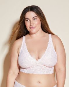 Longline plunge-front wireless bralette designed for Extended/Plus sizes. Soft, stretch, semi-sheer, scalloped lace. Longline band and power mesh lining add support. Non-padded cups with plunge front neckline. Pull-on style with wide, adjustable straps. Hand wash, do not dry in dryer. Cosabella: Women's Bras and Underwear. White Lace Bra, White Lace Bralette, Pink Lillies, White Bralette, Never Say Never, Plus Size Bra, Scalloped Lace, Lace Bralette, Long A Line