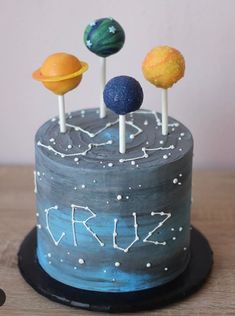 a birthday cake decorated with planets and stars