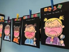 children's drawings are hung on the wall