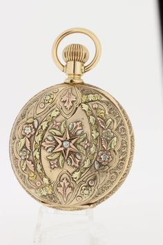 "This 14K tri colored floral and diamond pocket watch is engraved with the initials \"F.H.\". The dial is marked with CHKenkel Cincinati, OH. The movement is signed Seth Thomas.The case measures 54.20mm wide/diameter, and is 20mm tall. C8981GYPPPK --Please reference our policy for more details-- For International orders, please provide a phone number for shipping purposes. Just place a note in the comment box during check out.Thank you.**" Antique Engraved Jewelry And Watches For Wedding, Victorian Engraved Watch With Round Dial, Victorian Engraved Watches With Round Dial, Victorian Style Engraved Watch With Round Dial, Heirloom Style Engraved Jewelry And Watches As Gift, Heirloom Engraved Jewelry And Watches As Gift, Heirloom Engraved Jewelry And Watches For Gift, Heirloom Engraved Pocket Watch For Wedding, Victorian Engraved Round Pocket Watch