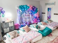 a room decorated with balloons and decorations for a birthday