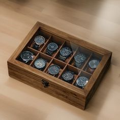 a wooden watch box with twelve watches in it on a wood flooring surface,