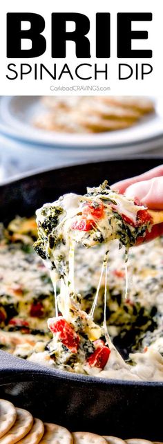 spinach dip being lifted from a skillet