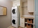 the laundry room is clean and ready to be used as a washer and dryer