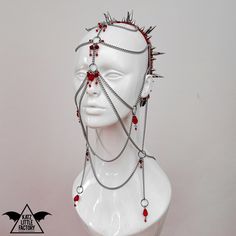 ~The Countess Headdress~ RED Sturdy headband decorated with various large spikes, claws and studs - largest spikes are about 40mm. Fastening with elastic strap under the hair. Stainless steel chains, arranged rings with red glass crystals and drops, all draping across the face, that move freely with every step. Lowest of the chain veils has fastening at the back (like a necklace) with clasp, adjustable to your size. Headband Art Reference, Human Harness, Head Necklace, Cool Head Accessories, Chain Harness Outfit, Head Peices Art, Face Harness, Metal Head Piece, Face Chain Jewelry