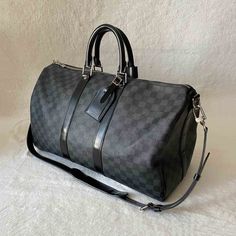 Description: Pre-Owned Louis Vuitton Damier Graphite Keepall 45 Bandouliere Includes Dustbag, Lock, Keys, Name Tag, and Handles Belt Condition: Pre/Loved in Very Good Condition. Minimal Marks of Use Estimated Retail: $1,950 Details: Black and Grey Coated Canvas / Black Leather Trim Silver-Tone Hardware / Dual Rolled HandlesDetachable and Adjustable Shoulder StrapBlack Fabric Lining at Interior / Zip Interior PocketDual Zip Closure at Top Measurements: Width 45cm / Height 27cm / Depth 20cm For mo Keepall 45, Pre Owned Louis Vuitton, Top Measurements, Louis Vuitton Damier Ebene, Vuitton Bag, Diaper Backpack, Name Tag, Casual Backpack, Leather Trim