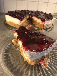 two slices of cheesecake on a glass plate