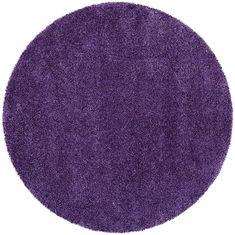 a round purple rug is shown on a white background and it looks like the area has been